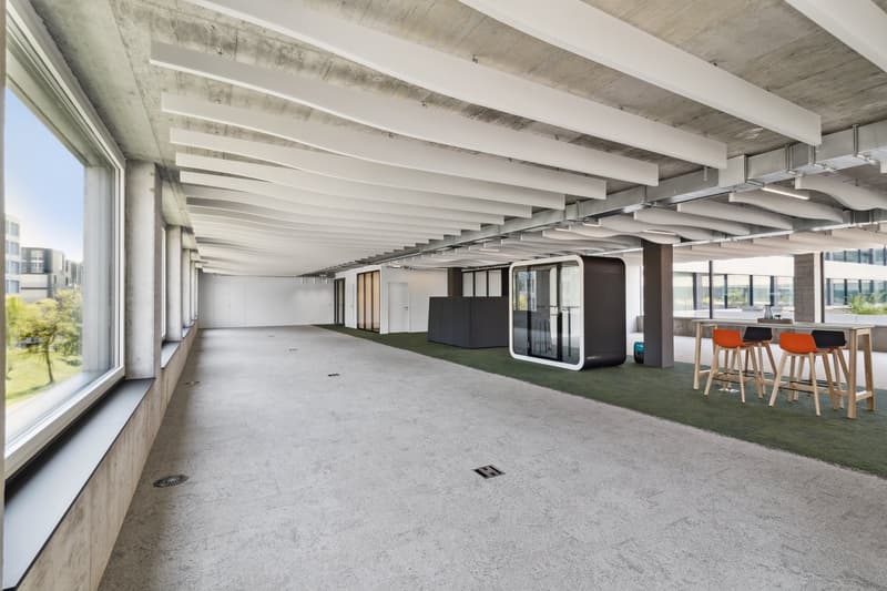 Empty hallway, large windows, metal beams, modern design, empty seats, large open area