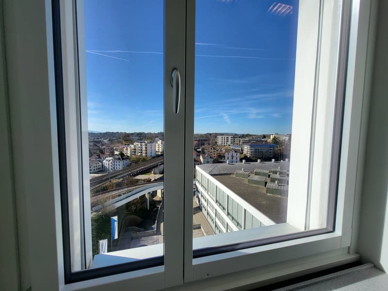 large window, view of the cityscape, modern architecture