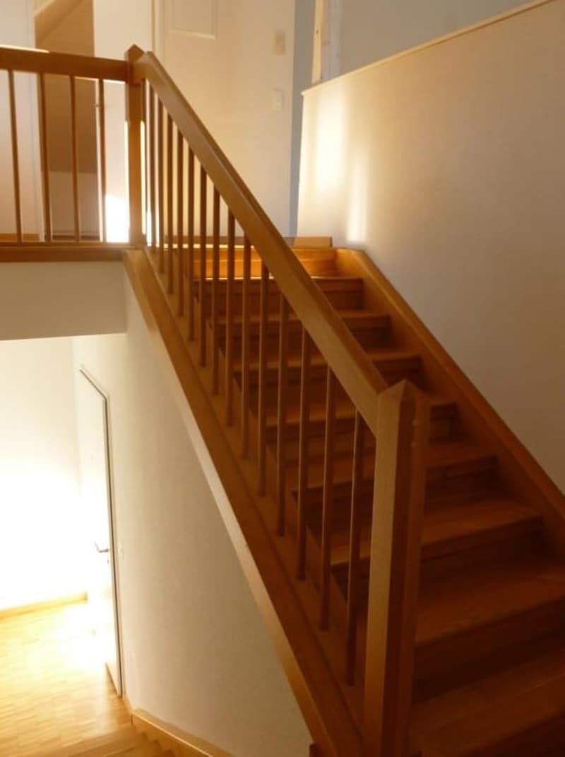 Wooden staircase with two sides.