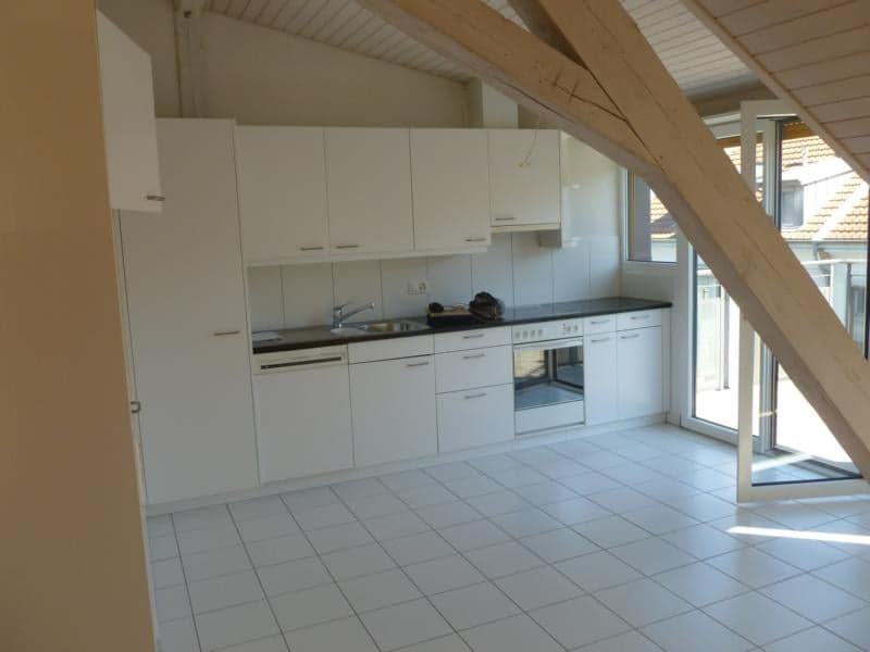 white tiled floor, white kitchen cabinets, stainless steel sink, dishwasher, open balcony