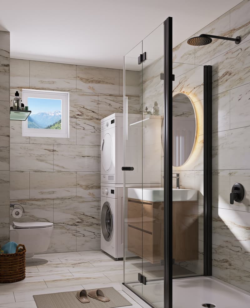 Modern bathroom with glass shower, vanity, and laundry machines