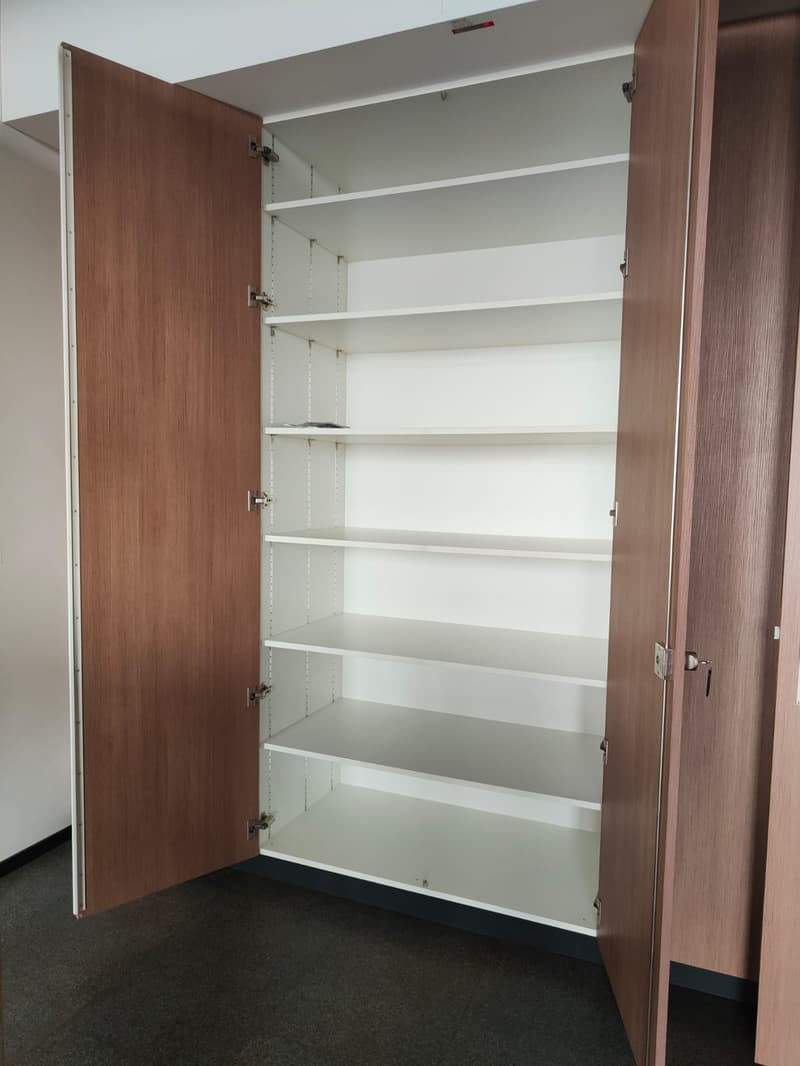 Empty double side wood and white shelves wardrobe