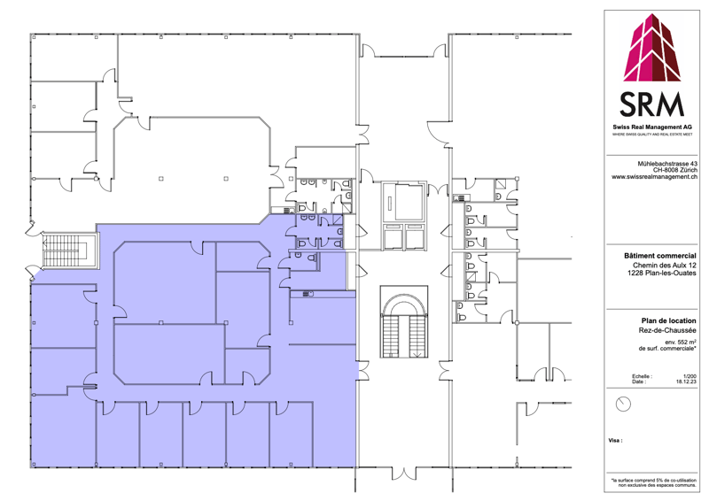 The floor plan shows a commercial building with multiple rooms, including a large open area, several smaller rooms, and a staircase. The building appears to have a parking area or garage space.