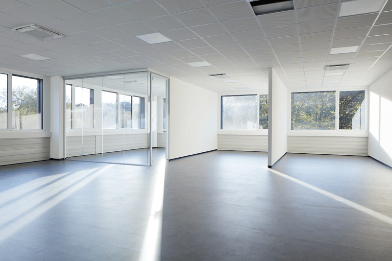 Spacious room, large glass windows, grey tiles, white walls, ceiling panels