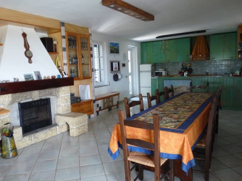 dining table, dining chairs, fireplace, kitchen