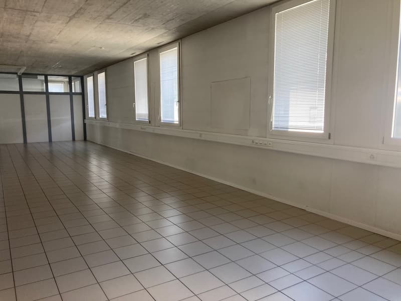 tiled floor, white walls, windows, no furniture