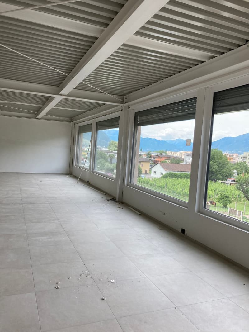 empty room, white walls, tiled floor, large windows, mountain view
