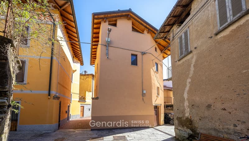 3 story house, beige walls, brown roof, garage, narrow street