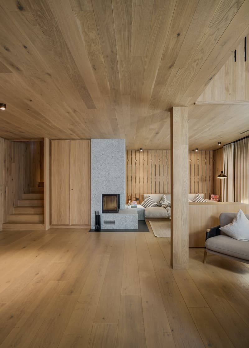 wooden floor, wooden ceiling, fireplace, wooden walls, stairs, couch, armchair, lamp