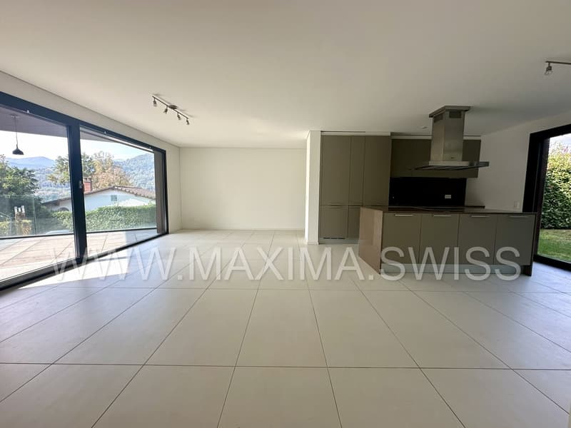 empty room, large windows, white tile, open kitchen, ceiling lamps, balcony