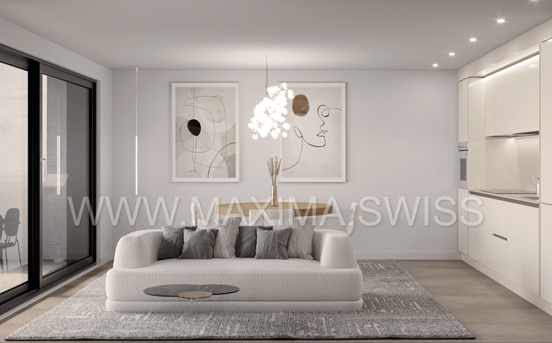 large glass door, couch, table, ceiling lights, two paintings, kitchen, island