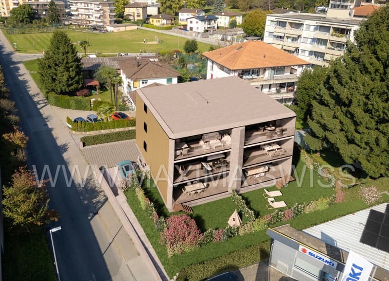 Apartment building, 4 floors, balconies on each floor, garage parking
