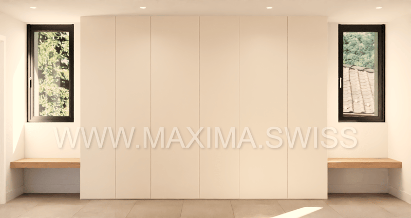 large white wardrobe, benches on each side, windows with outside view