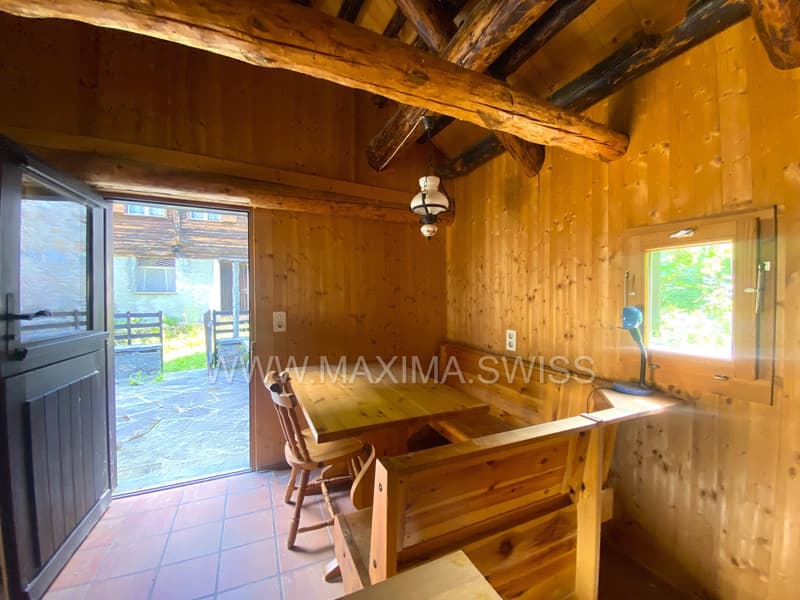 wooden walls, open door, wooden dining table, wooden chairs, wooden bench, lamp, open window