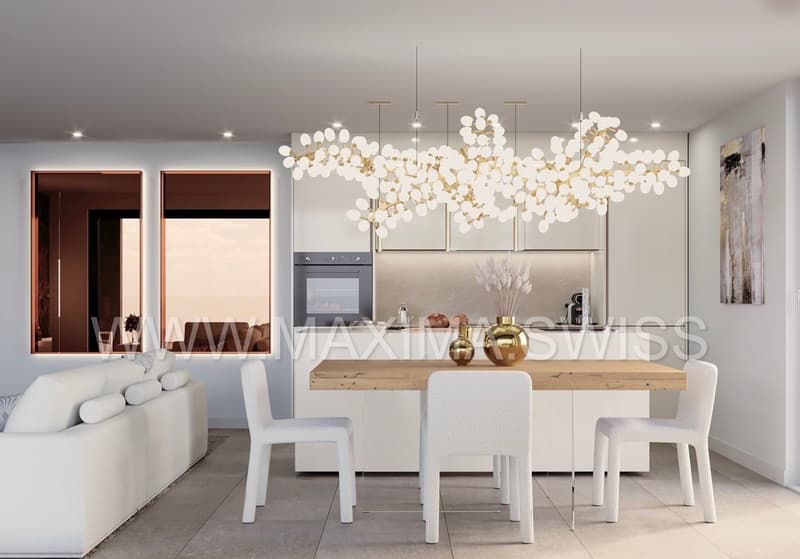 modern dining room with wooden table, white chairs, chandelier, white couch, kitchen with oven, countertop, and decorative items