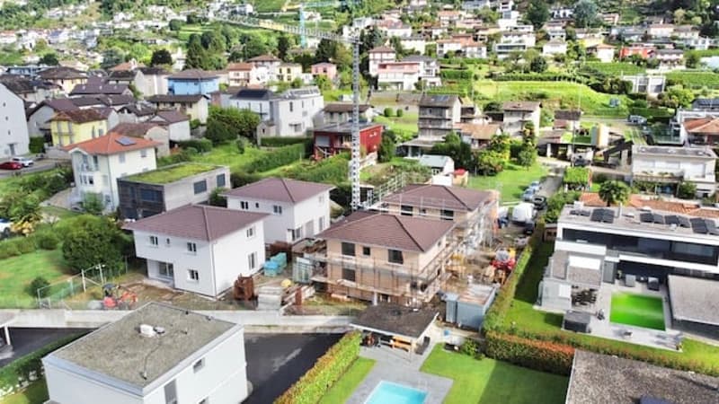 Aerial view of a housing development with several residential houses, under construction