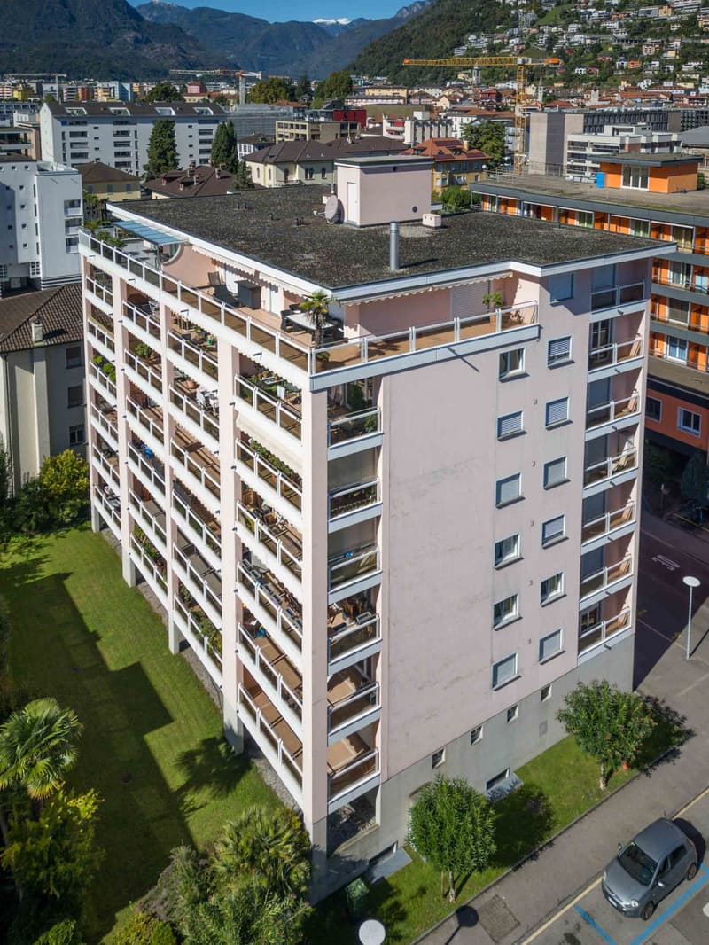 High-rise apartment building with multiple balconies on each floor
