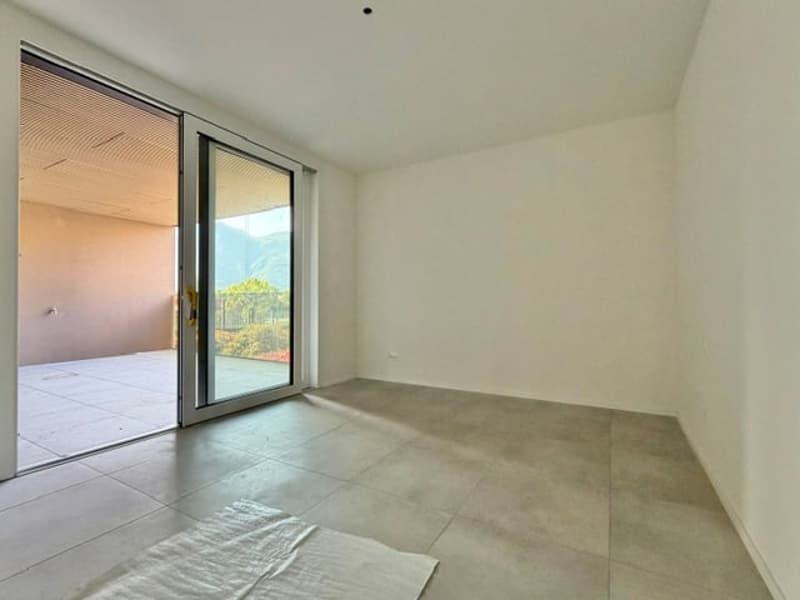 empty room, sliding glass door, balcony, tiled floor, white walls