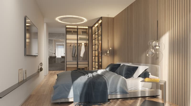 A large bed, bed spread and blanket, bedside table with book, large window, large wardrobe, ceiling lamp