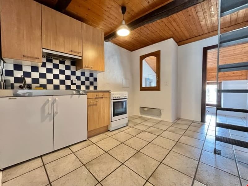 kitchen, tiled floor, wooden cabinets, stove, refrigerator, checkered tile backsplash