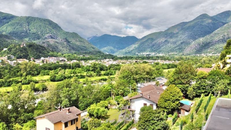 aerial view of village, mountains, houses, swimming pool, garden