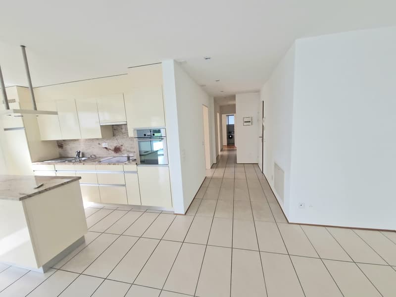 modern kitchen with white cabinets, granite countertops, stainless steel appliances, tiled floor