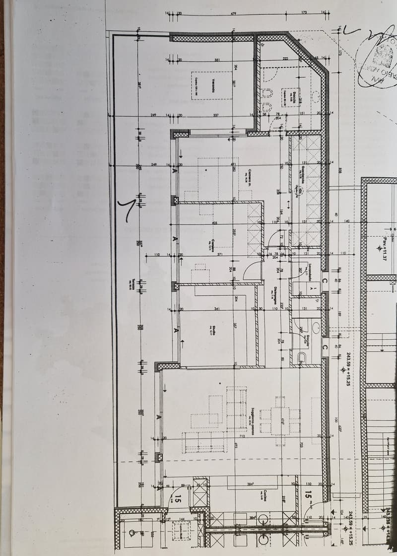 The image shows a detailed floor plan with various rooms and dimensions. The plan includes a living room, kitchen, two bedrooms, and two bathrooms.