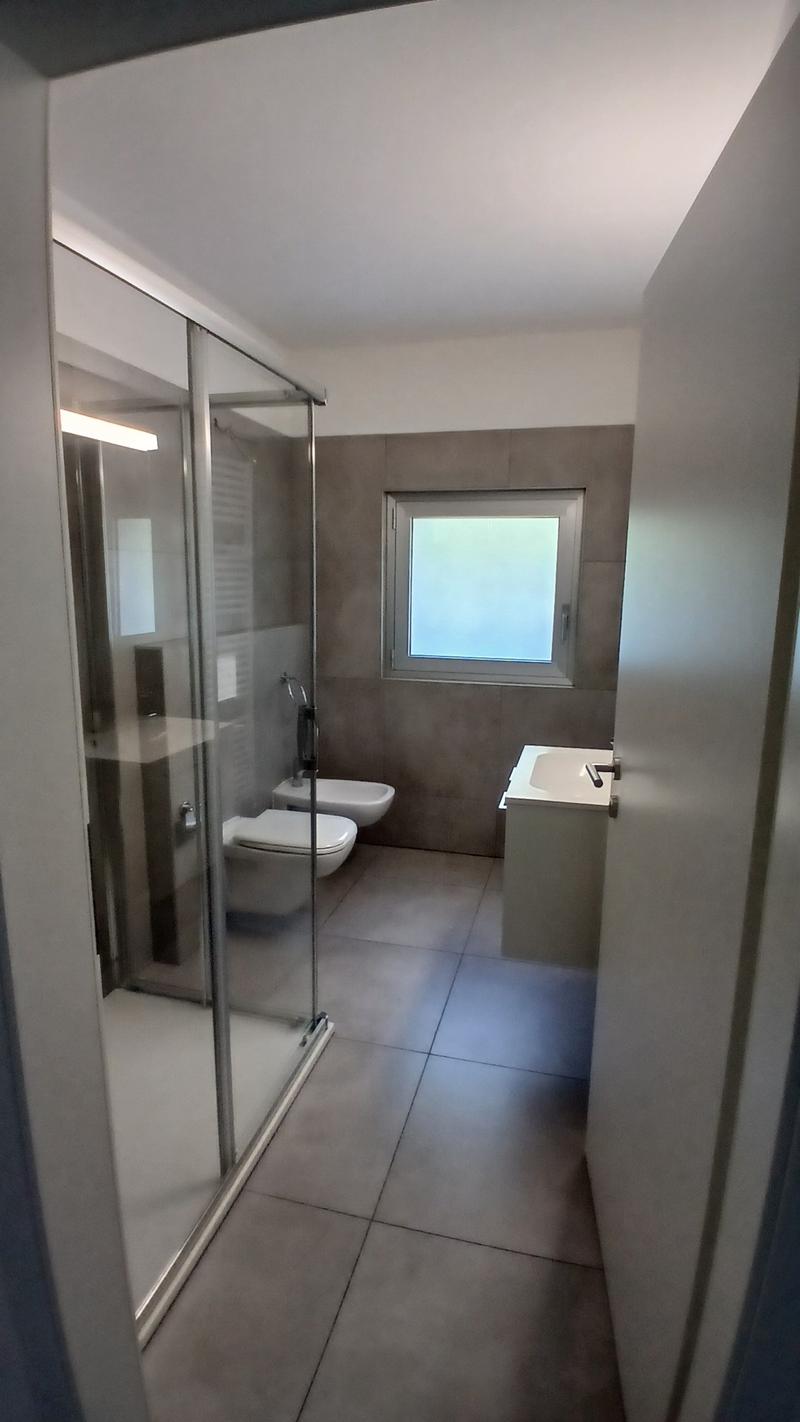 Modern 2.5-room apartment with terrace and private garden in Pazzallo (11)