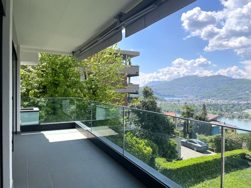 glass railing, tiled floor, view of mountains and lake