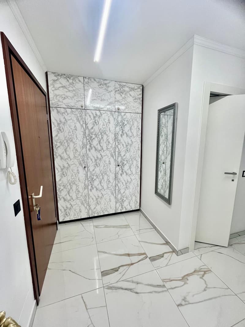 Elegante 3.5 locali con 2 terrazze vista lago box auto e posto auto (12)