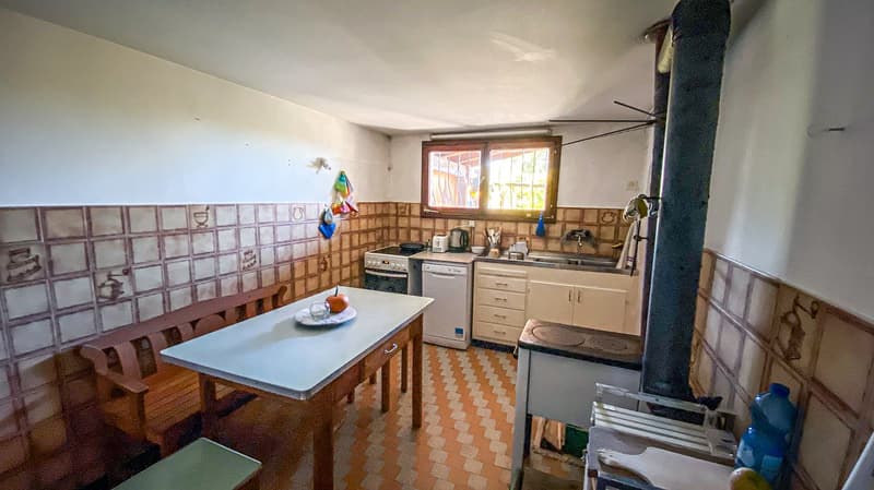 kitchen with appliances and tile walls