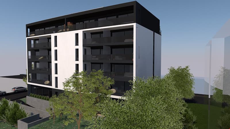 5-story modern apartment building with a black exterior and white accents, surrounded by lush greenery and landscaping