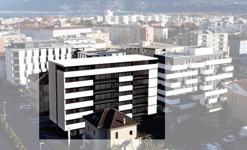 An apartment building in the city, has several balconies and terraces