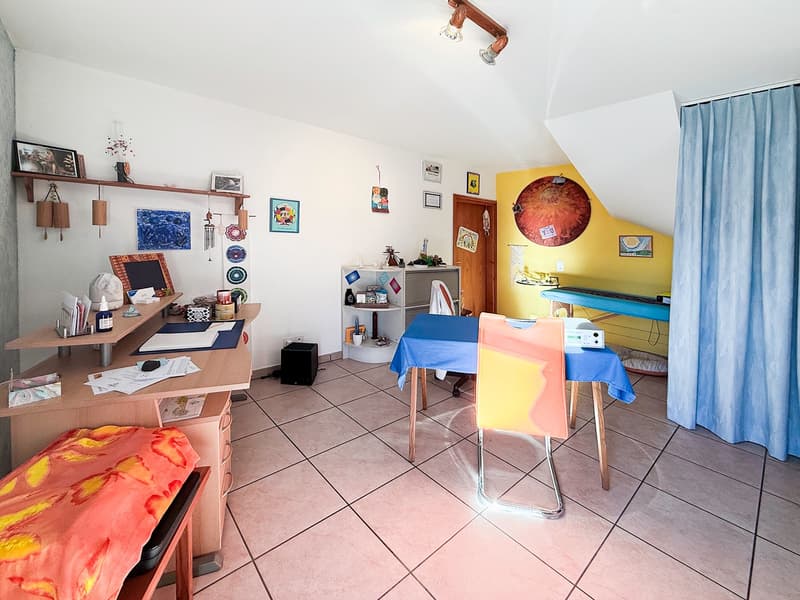 study room with desks, artwork, chair, table, speakers, floor tiles, curtains