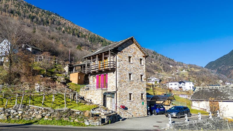 3 story house, stone wall, red shutters, car park, garage