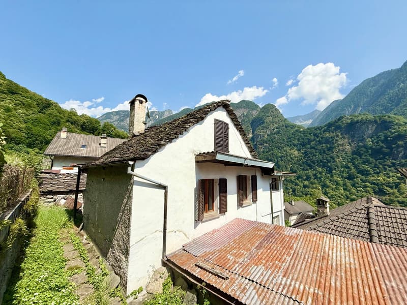 Traditional stone house, stone roof, chimney, mountain views