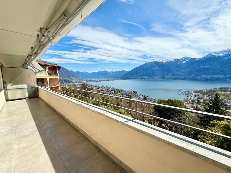 tiled floor, metal railing, lake view, mountain view