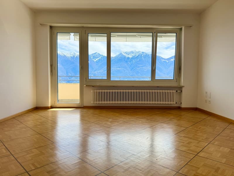 empty room, wooden floor, large windows, balcony, white walls, white radiator