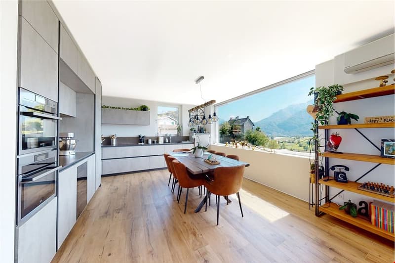modern kitchen with wooden floor, large windows, dining table, wooden chairs, shelves with plants and books