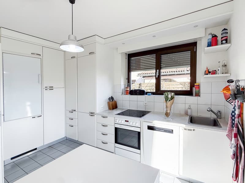 modern kitchen with white cabinets, tiled floor, white countertops, gas stove, oven, sink, dishwasher, window with blinds, pendant light