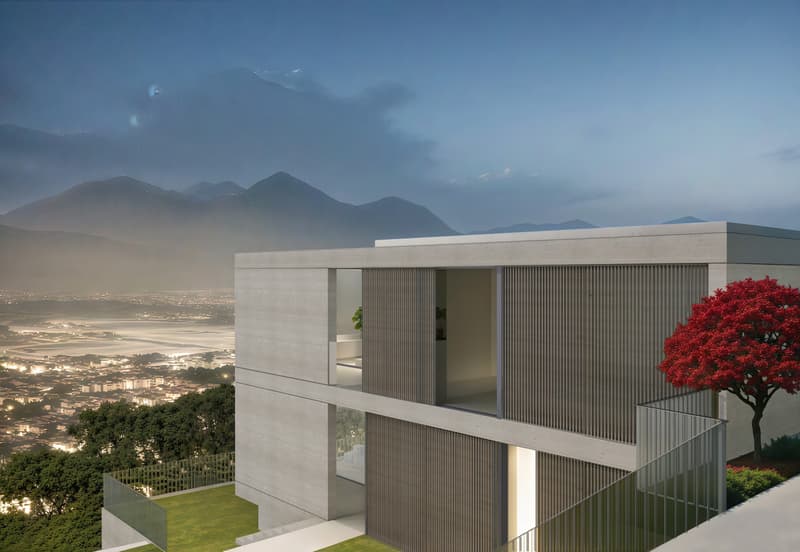 Modern concrete and glass house with balconies, situated on a hillside overlooking a city and mountains in the distance. The house has a minimalist, geometric design with clean lines and large windows providing panoramic views. A red tree is visible in th