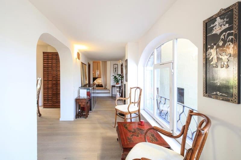 wooden floors, arched windows, furniture, wall decorations, arched doorways