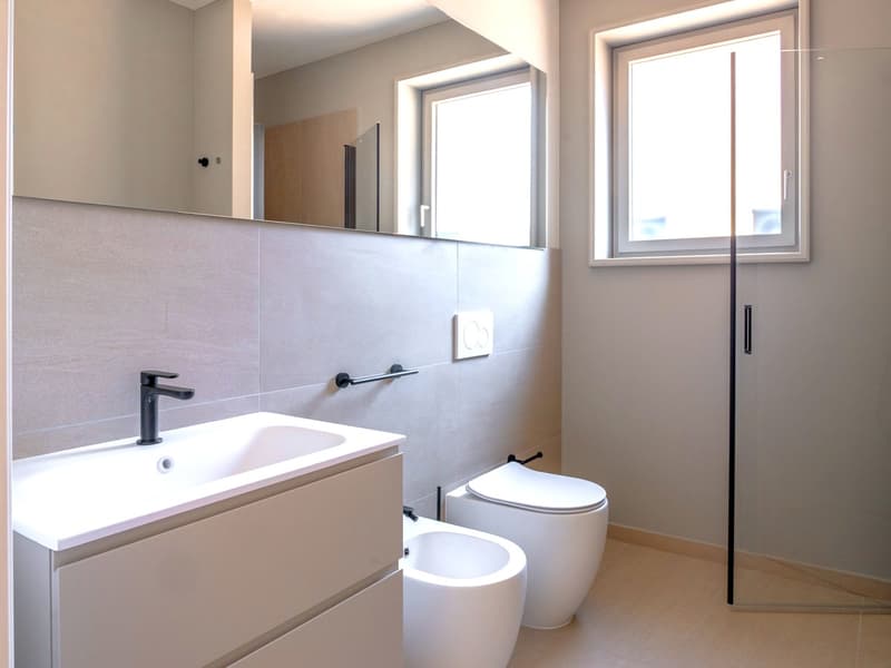 Appartement tout neuf de 2,5 pièces avec jardin privé et portique (9)