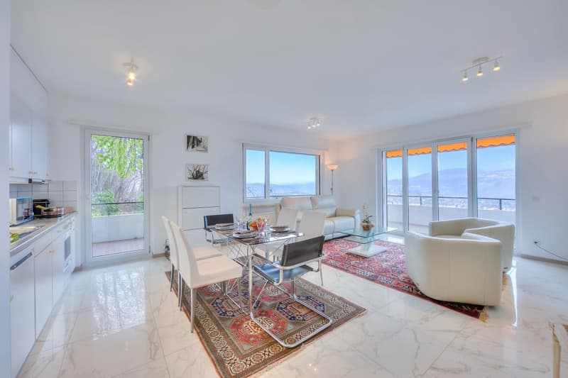 marble flooring, dining table, couch, rug, large windows, balcony, mountain view