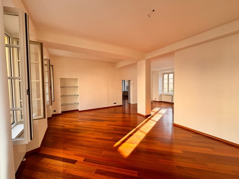 empty room, hardwood floors, white walls, large windows, high ceiling