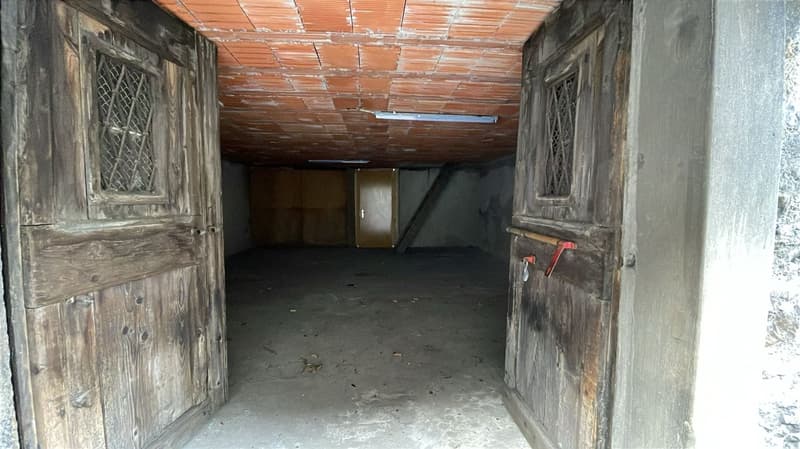 Storage room with red tile ceiling, wooden doors, wooden floor