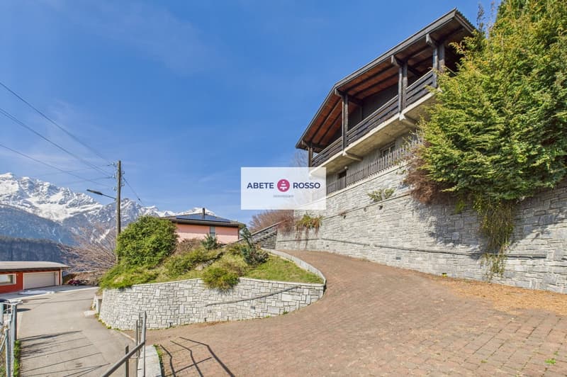 House with balcony, brick wall, driveway, garage, mountain view