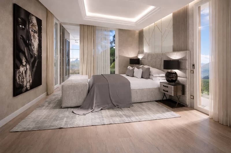 modern bedroom with large bed, large windows, artwork, carpet, nightstands, lamps, sliding doors
