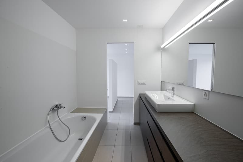 Oasi di prestigio a 10 minuti dal centro di Lugano: Moderno 3.5 locali con ampio giardino (26)