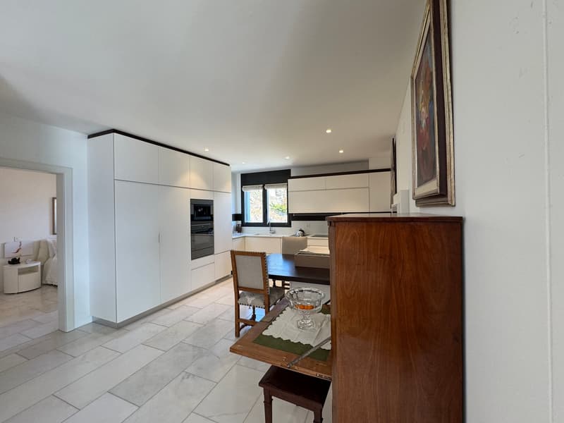 spacious kitchen, modern style, white cabinets, wooden table, modern furniture, white floor